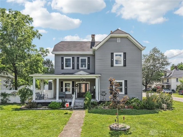213 N Broadway St, Blanchester, OH 45107 - view of front of house with a porch, a front lawn, and a chimney