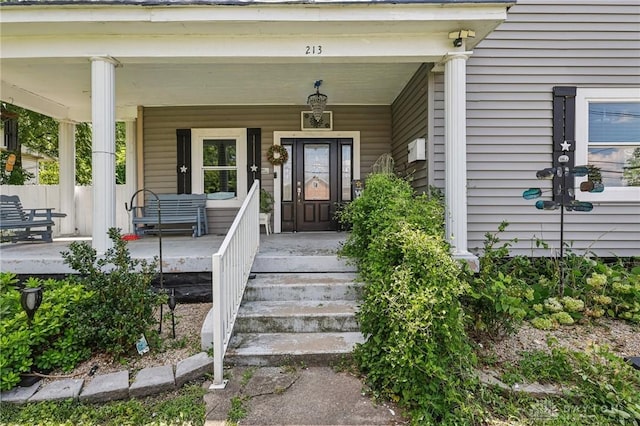 213 N Broadway St, Blanchester, OH 45107 - entrance to property featuring covered porch and a security system