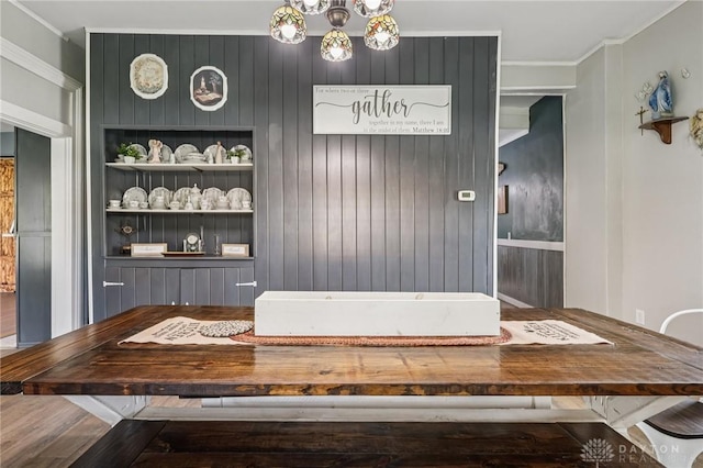 213 N Broadway St, Blanchester, OH 45107 - dining space with crown molding, built in features, and a chandelier
