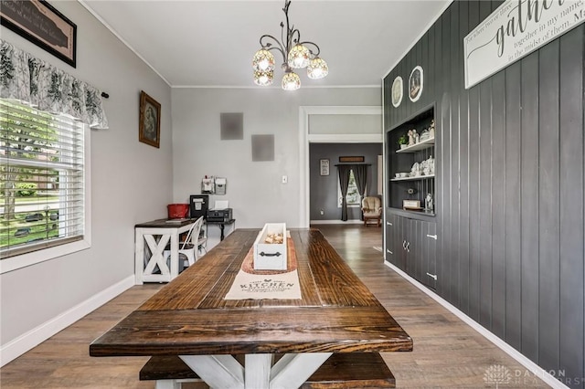 213 N Broadway St, Blanchester, OH 45107 - dining room featuring dark wood-style floors, a chandelier, crown molding, an office area, and built in shelves