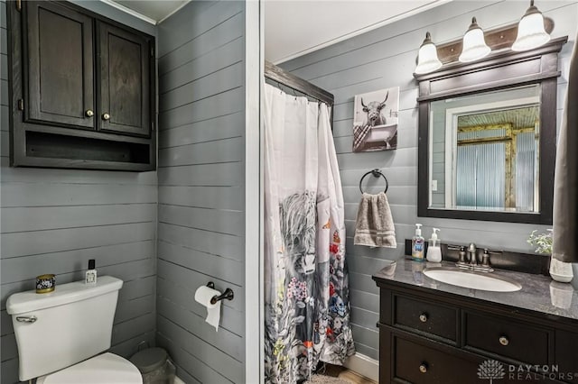 213 N Broadway St, Blanchester, OH 45107 - full bath with vanity, wooden walls, and a shower with shower curtain