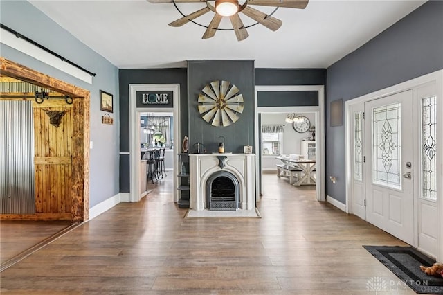 213 N Broadway St, Blanchester, OH 45107 - entrance foyer with ceiling fan and wood finished floors