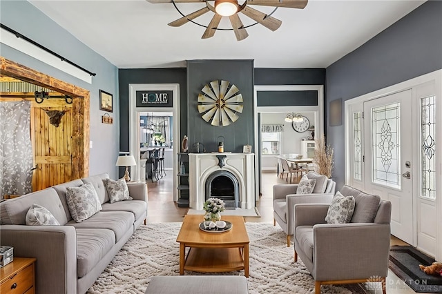 213 N Broadway St, Blanchester, OH 45107 - living area featuring ceiling fan and wood finished floors
