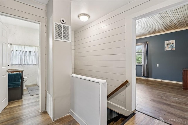 213 N Broadway St, Blanchester, OH 45107 - corridor with wood finished floors and wooden walls