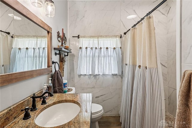 213 N Broadway St, Blanchester, OH 45107 - bathroom with curtained shower, vanity, and tile walls