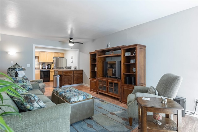 3301 Witherward Trl, Miami Twp, OH 45449 - living room featuring light wood-style flooring and a ceiling fan