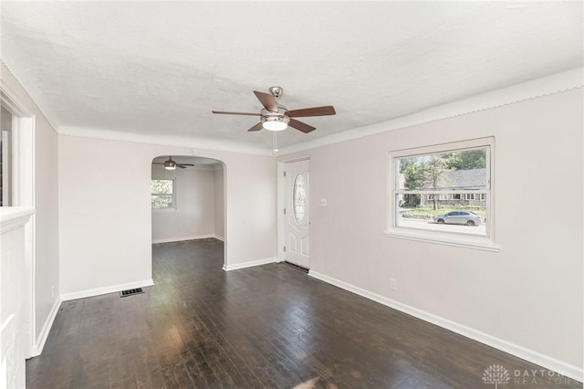 1337 Shepherd Ln, Hamilton, OH 45215 - empty room with ceiling fan, arched walkways, and wood finished floors