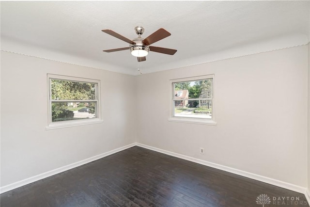1337 Shepherd Ln, Hamilton, OH 45215 - unfurnished room with plenty of natural light, a ceiling fan, and dark wood-style floors