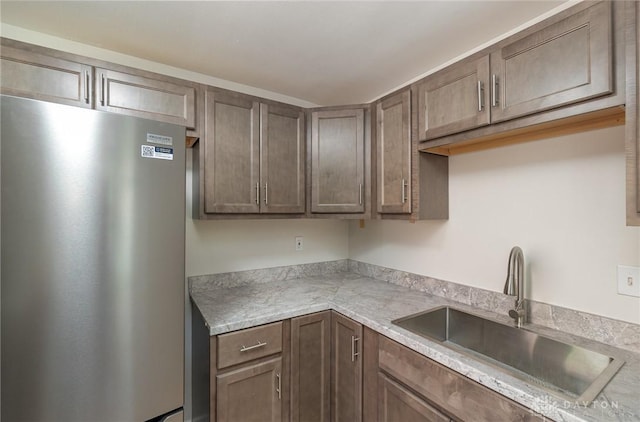 1337 Shepherd Ln, Hamilton, OH 45215 - kitchen with freestanding refrigerator and light countertops