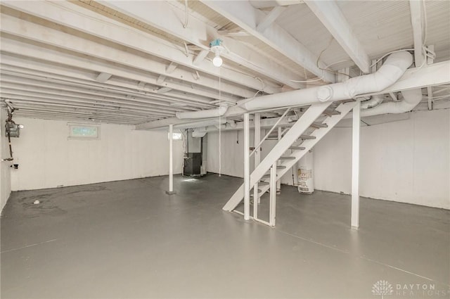 1337 Shepherd Ln, Hamilton, OH 45215 - below grade area featuring heating unit, water heater, and stairway