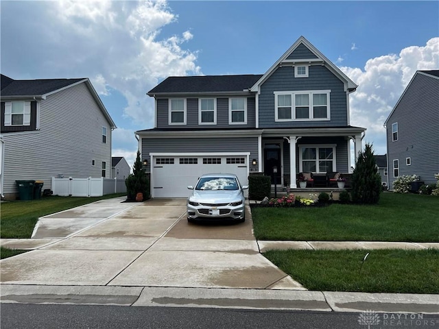138 Ridgebrook Trl, Beavercreek Twp, OH 45385 - view of front facade with covered porch, concrete driveway, and an attached garage