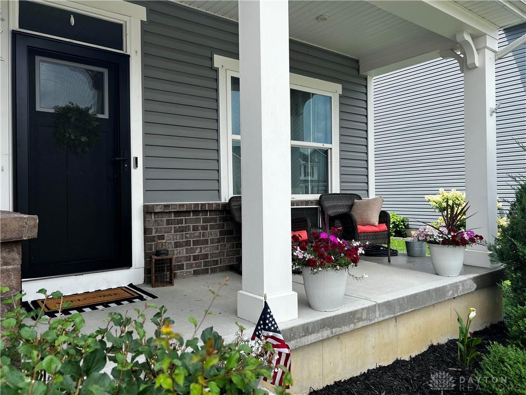 138 Ridgebrook Trl, Beavercreek Twp, OH 45385 - view of exterior entry with a porch