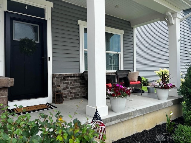 138 Ridgebrook Trl, Beavercreek Twp, OH 45385 - view of exterior entry with a porch