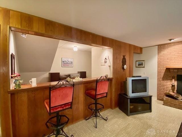 9476 Sheehan Rd, Dayton, OH 45458 - indoor dry bar with wooden walls and a brick fireplace