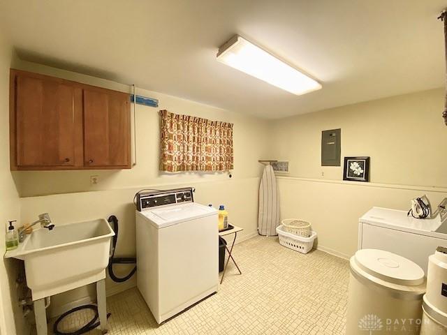 9476 Sheehan Rd, Dayton, OH 45458 - washroom featuring cabinet space, electric panel, and independent washer and dryer