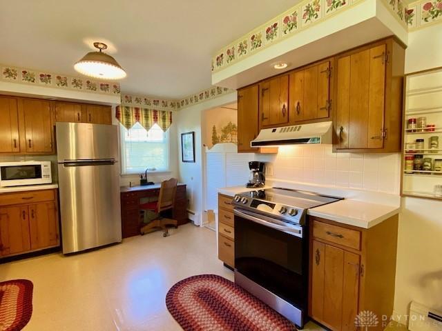 9476 Sheehan Rd, Dayton, OH 45458 - kitchen featuring appliances with stainless steel finishes, under cabinet range hood, and brown cabinetry