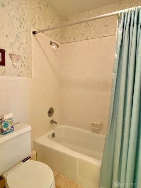 9476 Sheehan Rd, Dayton, OH 45458 - full bathroom featuring shower / bathtub combination with curtain, tile walls, and wainscoting