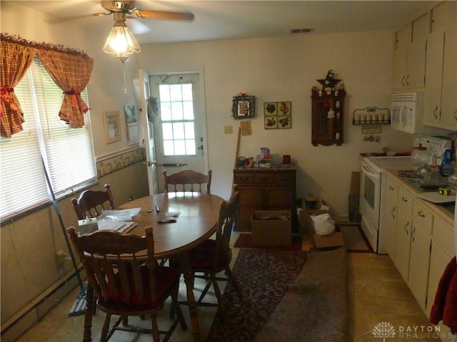 3784 Cheyenne Trl, New Jasper Twp, OH 45335 - dining area featuring a baseboard radiator and ceiling fan