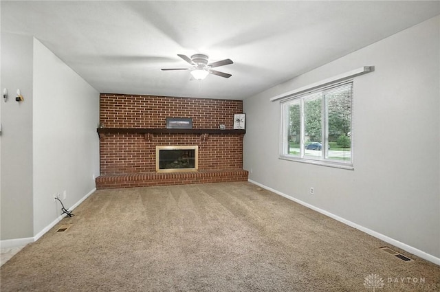 1360 Fenway Ct, Centerville, OH 45458 - unfurnished living room with a ceiling fan, carpet, and a brick fireplace