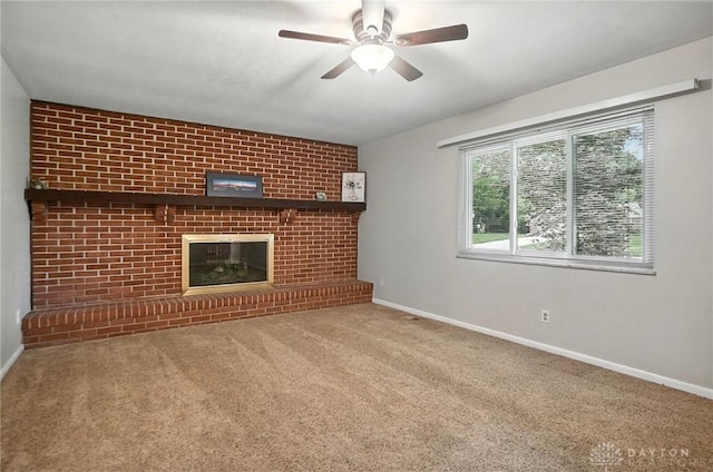 1360 Fenway Ct, Centerville, OH 45458 - unfurnished living room featuring carpet floors, ceiling fan, and a brick fireplace