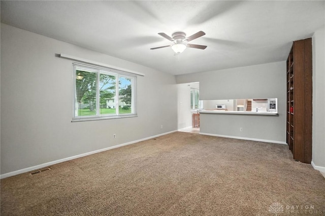 1360 Fenway Ct, Centerville, OH 45458 - unfurnished living room with a ceiling fan and carpet flooring