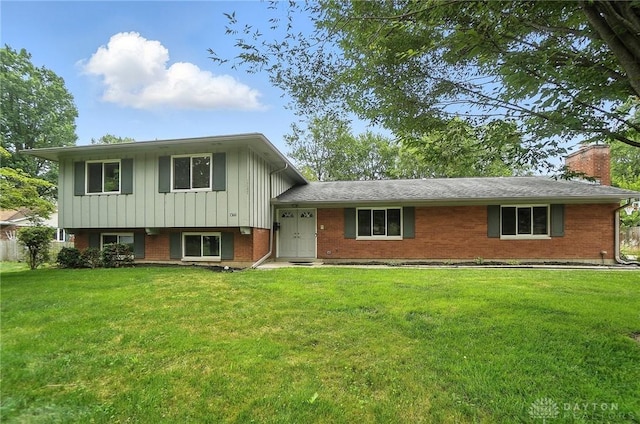 1360 Fenway Ct, Centerville, OH 45458 - tri-level home with a front yard, brick siding, a chimney, and board and batten siding