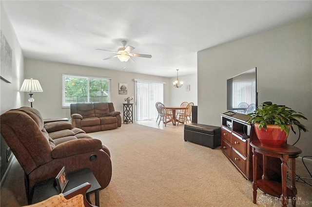 1360 Fenway Ct, Centerville, OH 45458 - living area featuring light carpet, a ceiling fan, and a chandelier