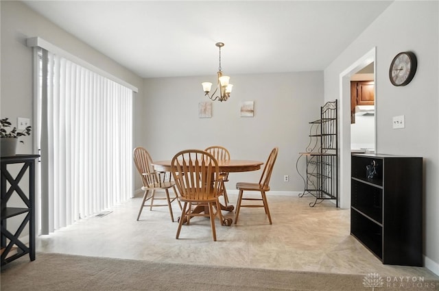 1360 Fenway Ct, Centerville, OH 45458 - dining area featuring a chandelier and baseboards