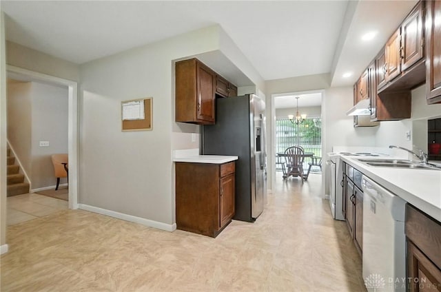 1360 Fenway Ct, Centerville, OH 45458 - kitchen with stainless steel fridge with ice dispenser, dishwasher, a chandelier, light countertops, and under cabinet range hood