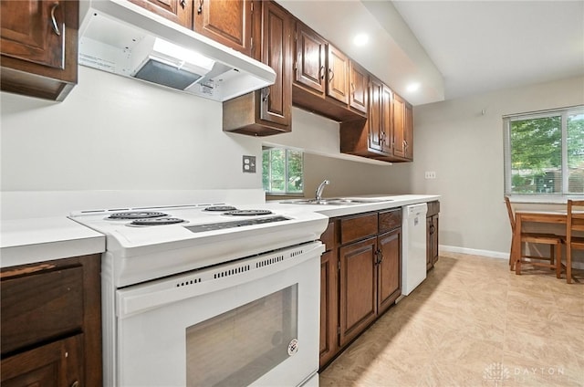 1360 Fenway Ct, Centerville, OH 45458 - kitchen featuring white appliances, under cabinet range hood, light countertops, healthy amount of natural light, and recessed lighting