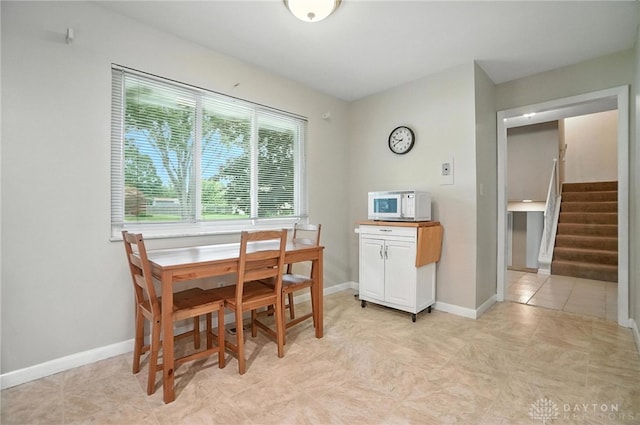 1360 Fenway Ct, Centerville, OH 45458 - dining room featuring stairway and baseboards
