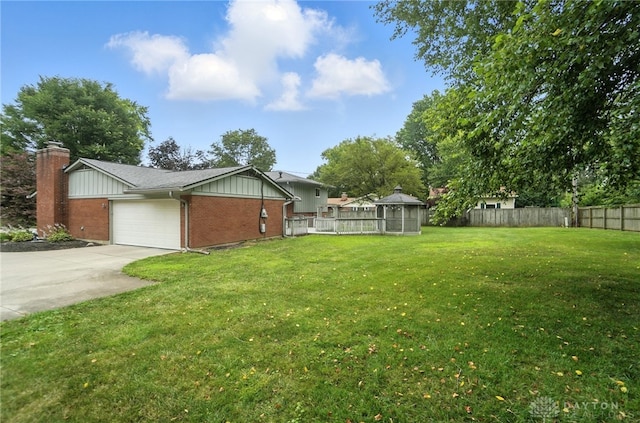 1360 Fenway Ct, Centerville, OH 45458 - view of yard featuring a gazebo, a garage, and driveway