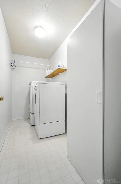 1360 Fenway Ct, Centerville, OH 45458 - laundry room with washer and dryer and baseboards