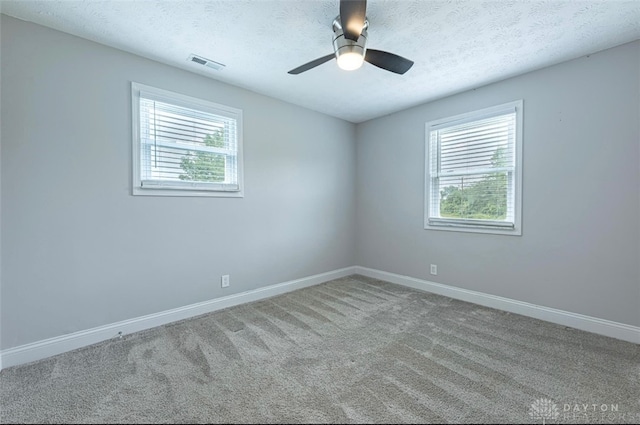 7143 S State Route 123, Blanchester, OH 45107 - carpeted empty room with a textured ceiling and ceiling fan