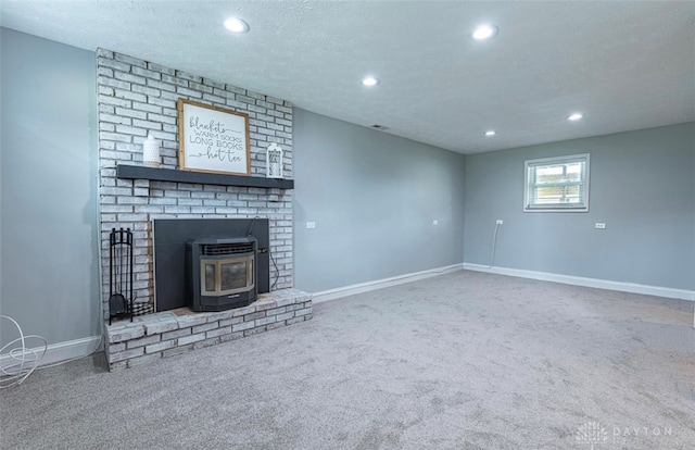 7143 S State Route 123, Blanchester, OH 45107 - unfurnished living room featuring carpet, recessed lighting, and a wood stove
