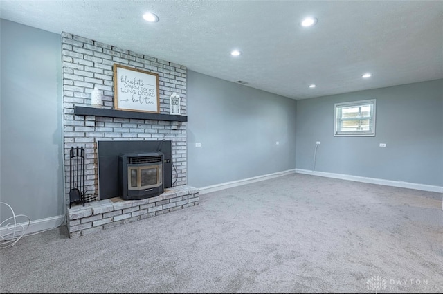7143 S State Route 123, Blanchester, OH 45107 - unfurnished living room with carpet floors, recessed lighting, a wood stove, and a textured ceiling
