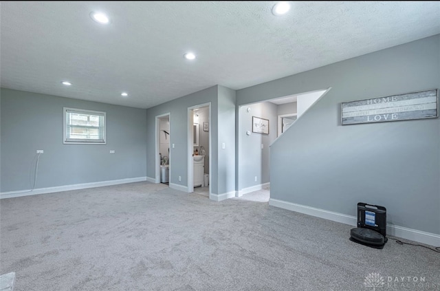 7143 S State Route 123, Blanchester, OH 45107 - below grade area with recessed lighting, light carpet, and a textured ceiling