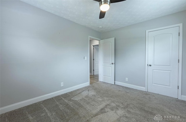 7143 S State Route 123, Blanchester, OH 45107 - unfurnished bedroom featuring carpet floors, a textured ceiling, and ceiling fan