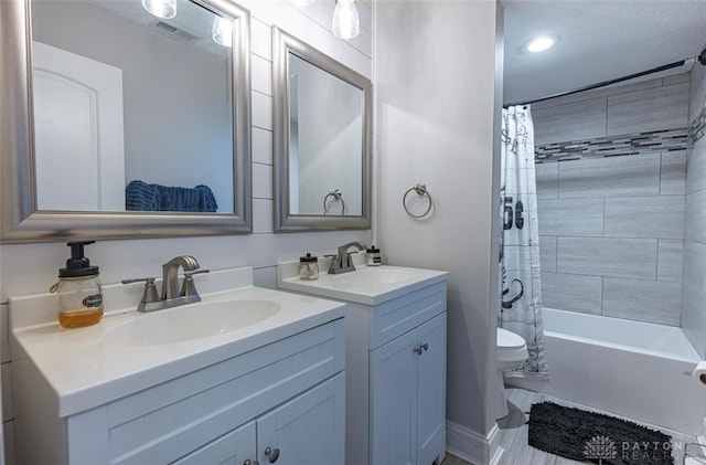 7143 S State Route 123, Blanchester, OH 45107 - bathroom with two vanities, shower / bath combo, and recessed lighting