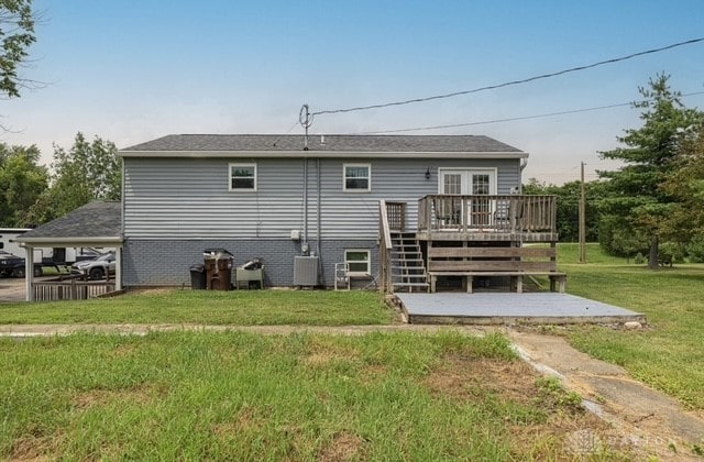7143 S State Route 123, Blanchester, OH 45107 - rear view of house featuring a wooden deck, a yard, and stairway