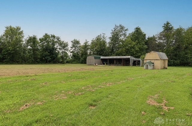7143 S State Route 123, Blanchester, OH 45107 - view of green lawn featuring a storage unit