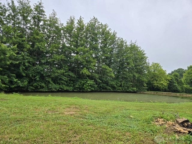 7143 S State Route 123, Blanchester, OH 45107 - view of grassy yard featuring a water view and a wooded view