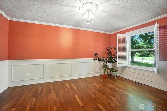 1572 Frontier Ct, Dayton, OH 45458 - unfurnished dining area featuring a textured ceiling, a chandelier, wood finished floors, a wainscoted wall, and ornamental molding