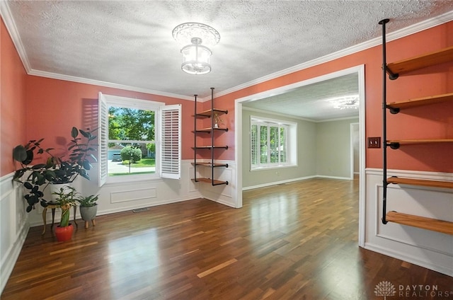 1572 Frontier Ct, Dayton, OH 45458 - dining room featuring plenty of natural light, wood finished floors, a textured ceiling, a chandelier, and ornamental molding