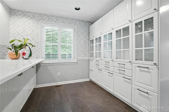 1572 Frontier Ct, Dayton, OH 45458 - interior space with wallpapered walls, white cabinets, and light countertops