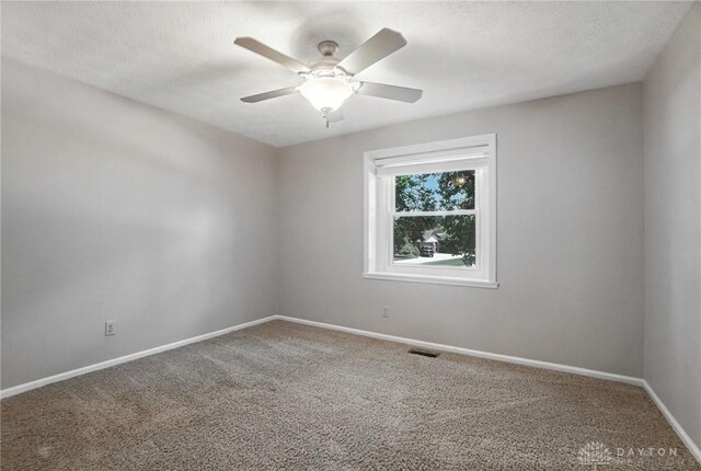 1572 Frontier Ct, Dayton, OH 45458 - carpeted empty room with a ceiling fan and a textured ceiling