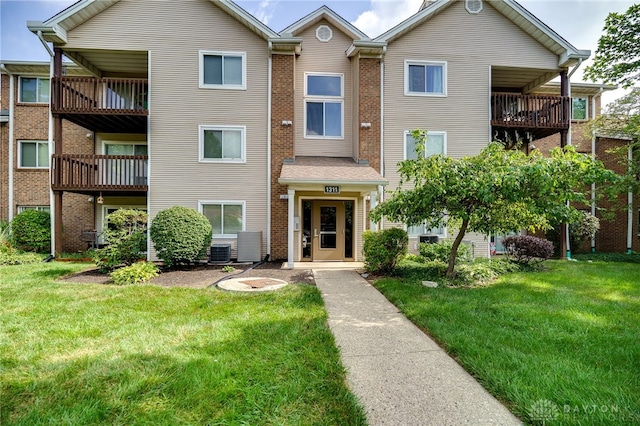 1311 Hollow Run Unit 6, Dayton, OH 45459 - view of front of home featuring a balcony and a front lawn