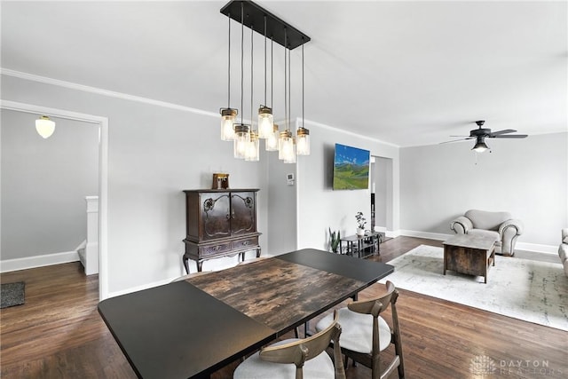 2594 Laura Ln, Norwood, OH 45212 - dining area with crown molding, a ceiling fan, and wood finished floors
