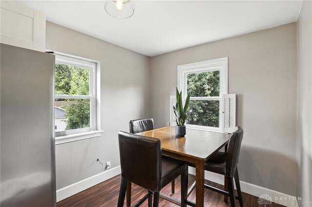 2594 Laura Ln, Norwood, OH 45212 - dining room with healthy amount of natural light and dark wood-style floors