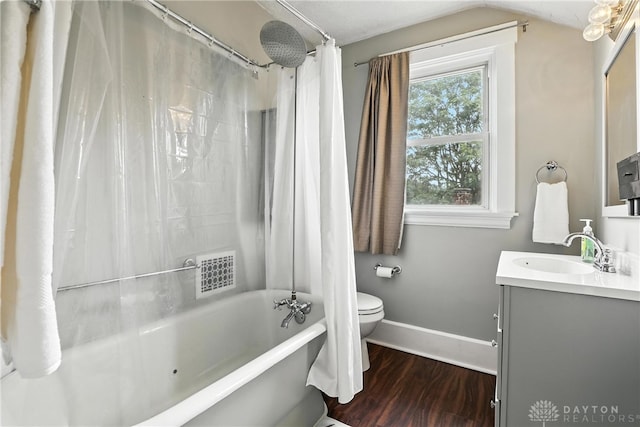 2594 Laura Ln, Norwood, OH 45212 - full bath featuring vanity, wood finished floors, shower / tub combo with curtain, and lofted ceiling